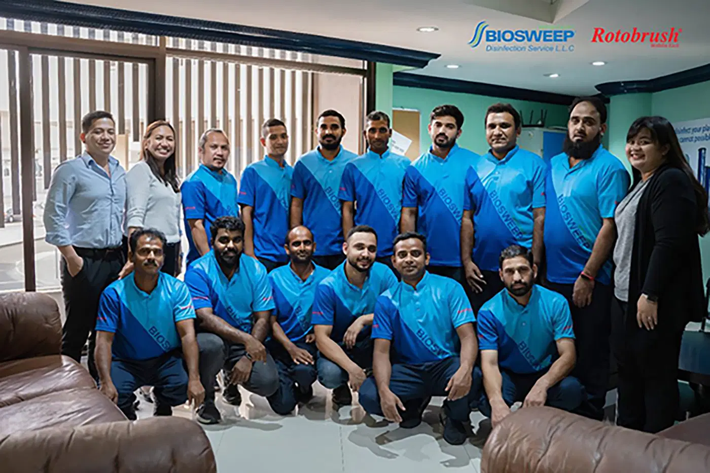 BioSweep team members photographed together in branded uniforms